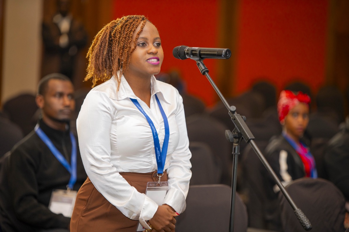 Rexa Mphuwa speaking at the microphone during the Africa Internet Summit